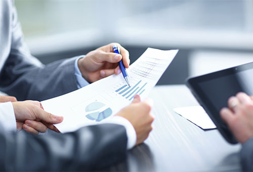 Businessman holding digital tablet at meeting