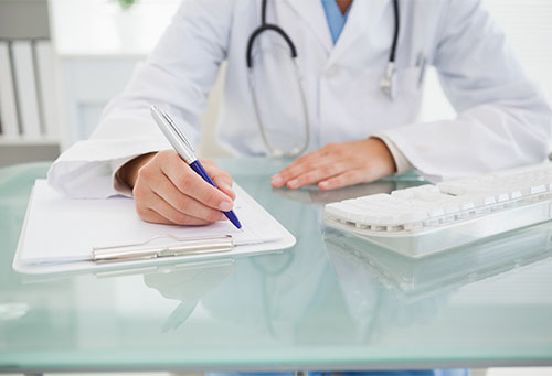 doctor writing down notes