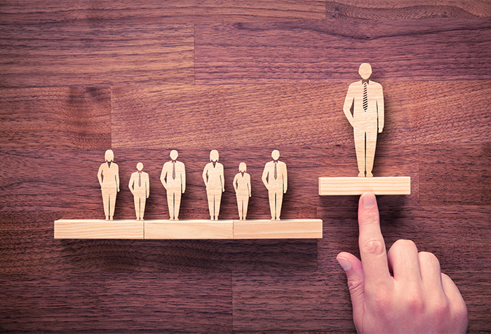 Leadership graphic with wooden people